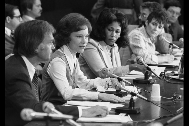 A black and white photo of Mrs. Rosalynn Carter speaking in front of an audience.