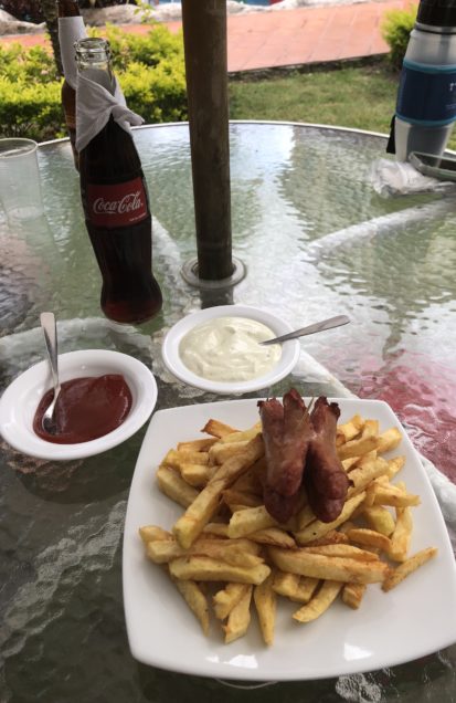 Salchipapas -- hot dog and French fries served with ketchup and mayonnaise -- is a popular street food in Vilcabamba, Ecuador.