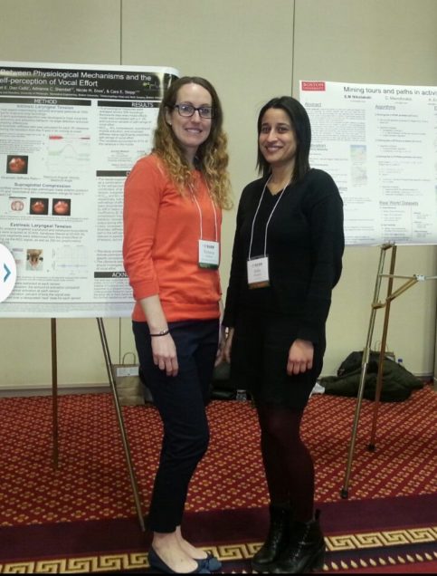 Victoria McKenna and a fellow student standing in front of her research poster.