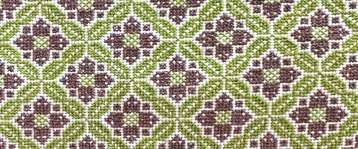 Palestinian embroidery Tatreez pattern in the colors green and brown