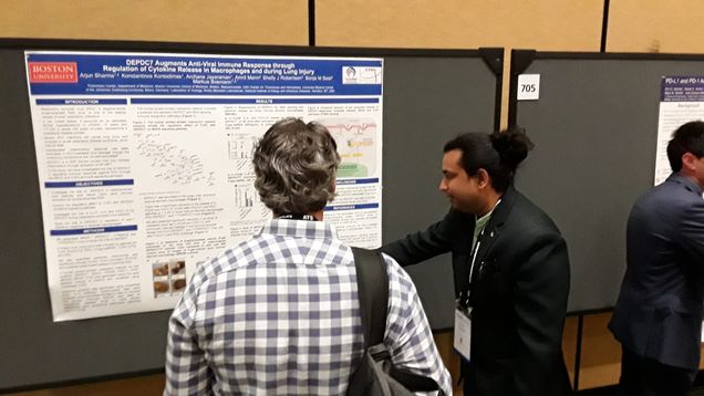 Photo of Arjun Sharma presenting a poster at the American Thoracic Society (ATS) International Conference, 2022