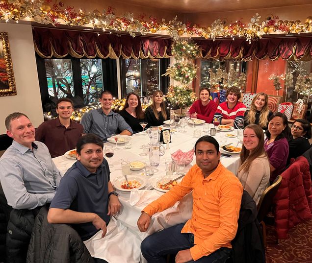 Bosmann Lab members around a table