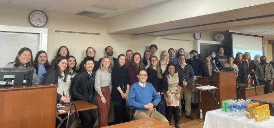The BUSPH Center for Climate and Health community posing for a picture in a classroom in February 2023.