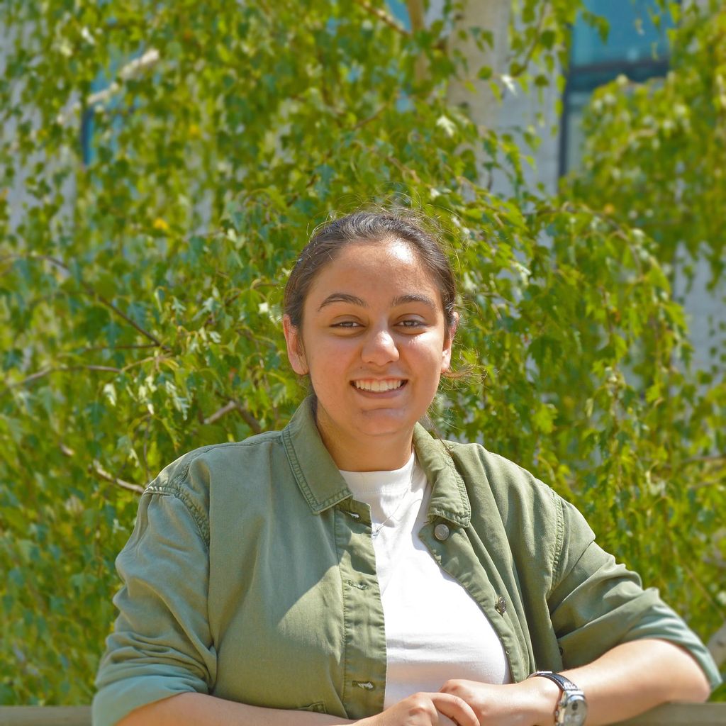 photo of jeanine nasser in front of leafy tree