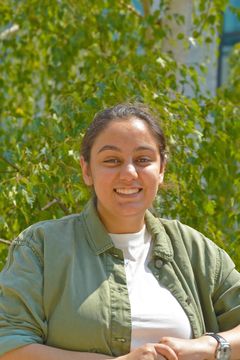 photo of jeanine nasser in front of leafy tree