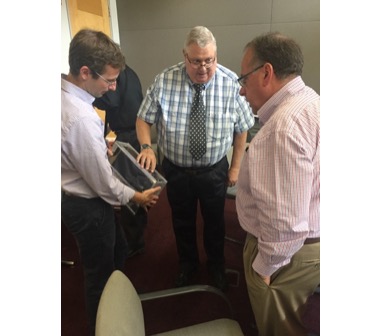 Brian Walsh (BU) Chuck Smith (AMA) and Kevin Jackson (Flexitech Aerospace) discuss the potential communications antenna positioning on the spacecraft.
