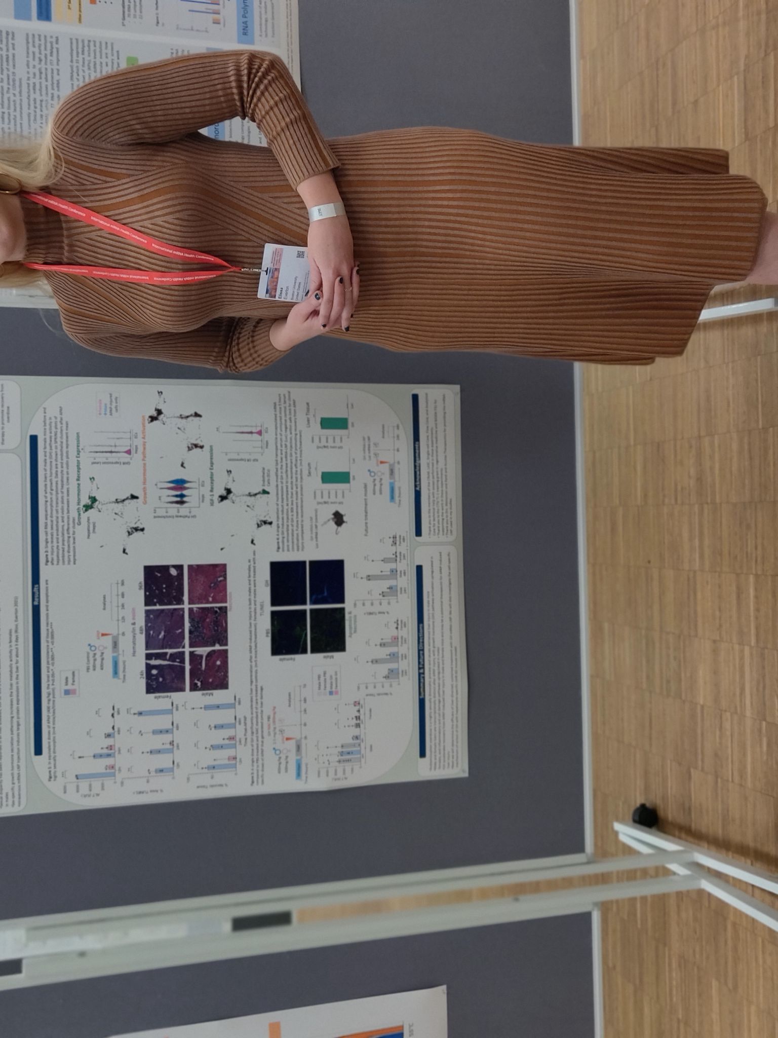 Elissa and her poster at the 9th International mRNA Health Conference