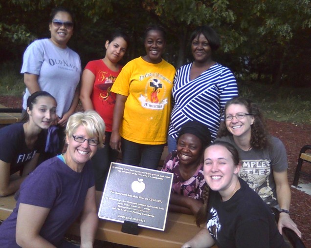 Figure 3: Students from Metropolitan State University and Inver Hills Community College Posing with the Newtown Victory Garden Bronze Plaque