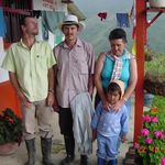 Colombian family outside their home