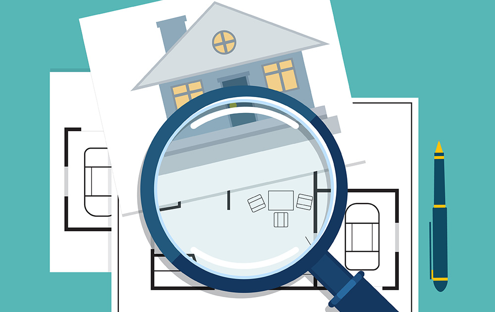magnifying glass on top of an image of a house and house floor plans