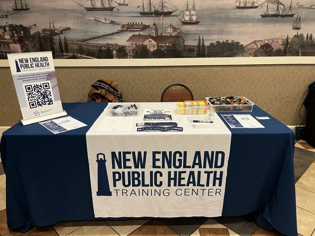 Table for NEPHTC at the MPHA conference, featuring informational materials and NEPHTC banner