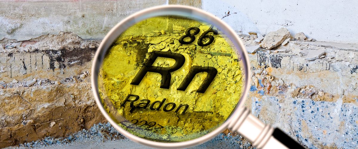 Magnifying glass highlighting the chemical symbol for radon (Rn) over a cracked basement wall and concrete foundation.