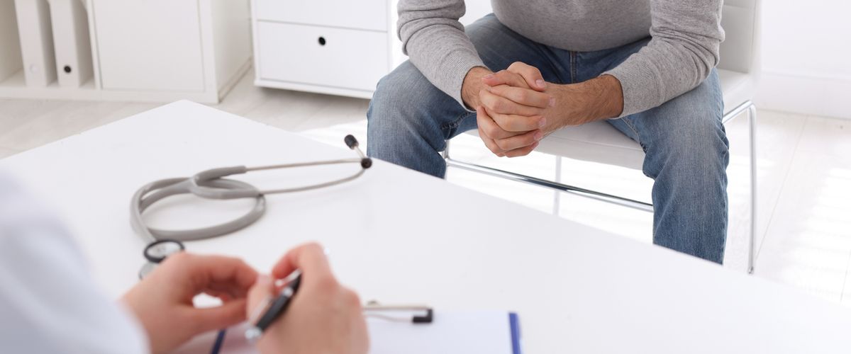 Man having appointment with STD specialist in clinic, closeup