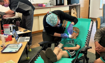 Child attending a visit to the dentist office.
