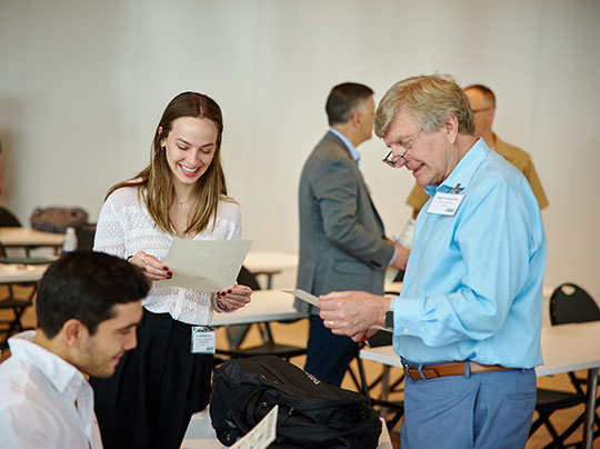 Participants networking at the 2025 Project Management in Practice Conference