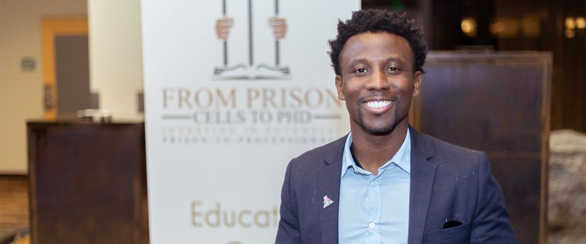 Man smiling at a conference